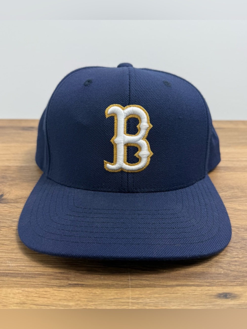 White & Gold Embroidered B on Navy The Classics Yupoong Snap Back Hat